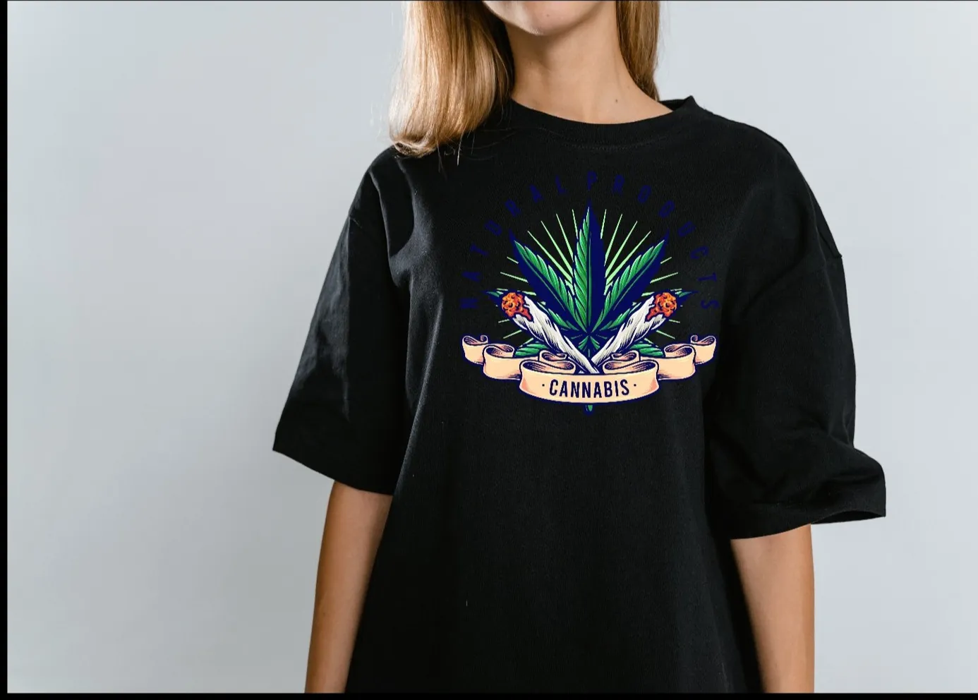 Woman wearing black t-shirt with cannabis leaf design and the word Cannabis.