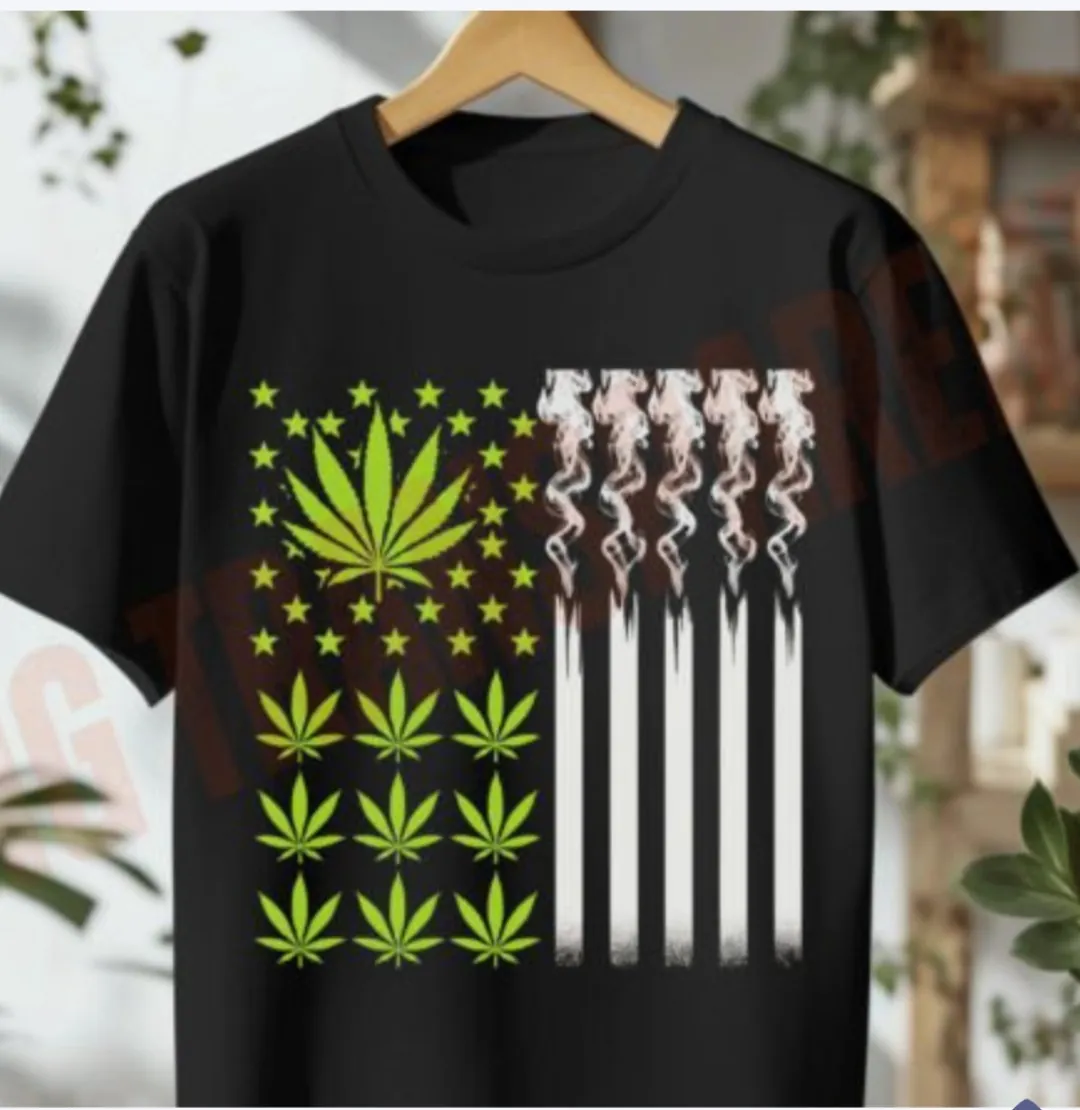 Black tee shirt with marijuana leaf flag design, Roll some Spirit and More.