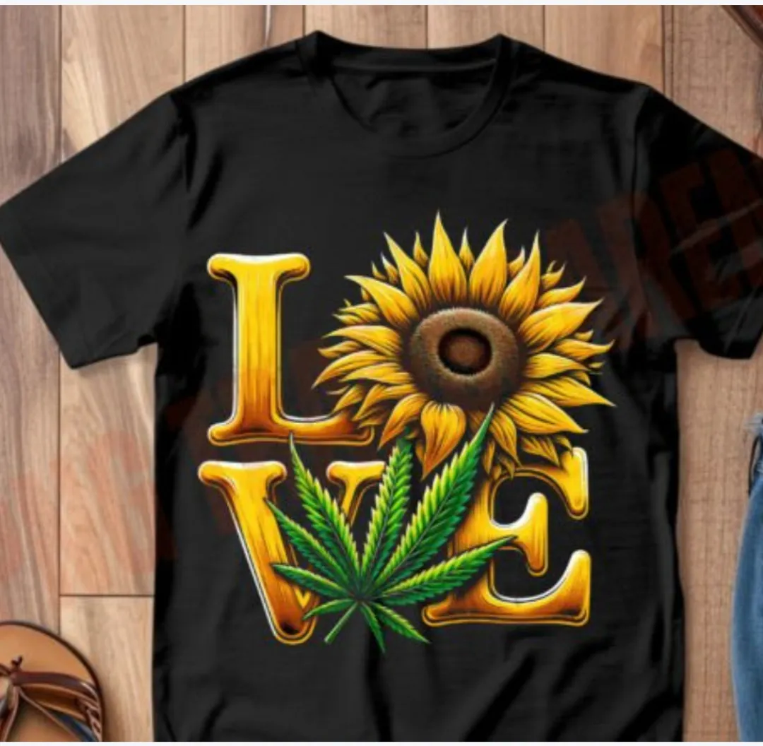 Black T-shirt with the word LOVE, sunflower, and cannabis leaf detail.